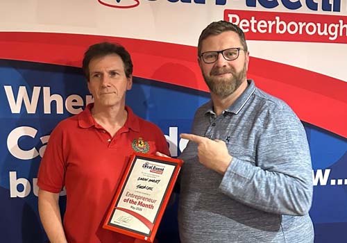 Daron Harvey receiving Entrepreneur of the Month award